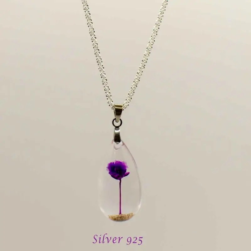Handmade necklace with real dried purple flower in clear teardrop resin pendant on silver chain
